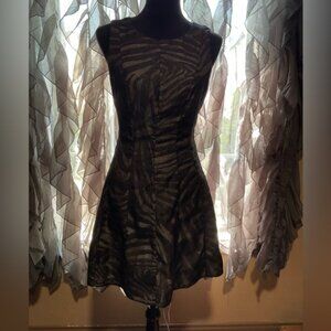 Bebe size 6 sleeveless black zebra print with beige underlay mini dress